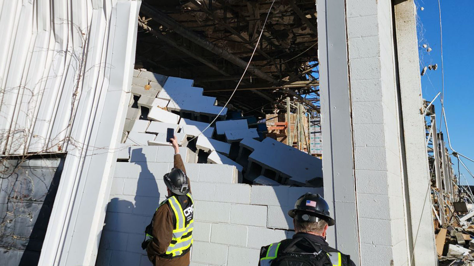 CRC team assessing tornado damage to a warehouse building.