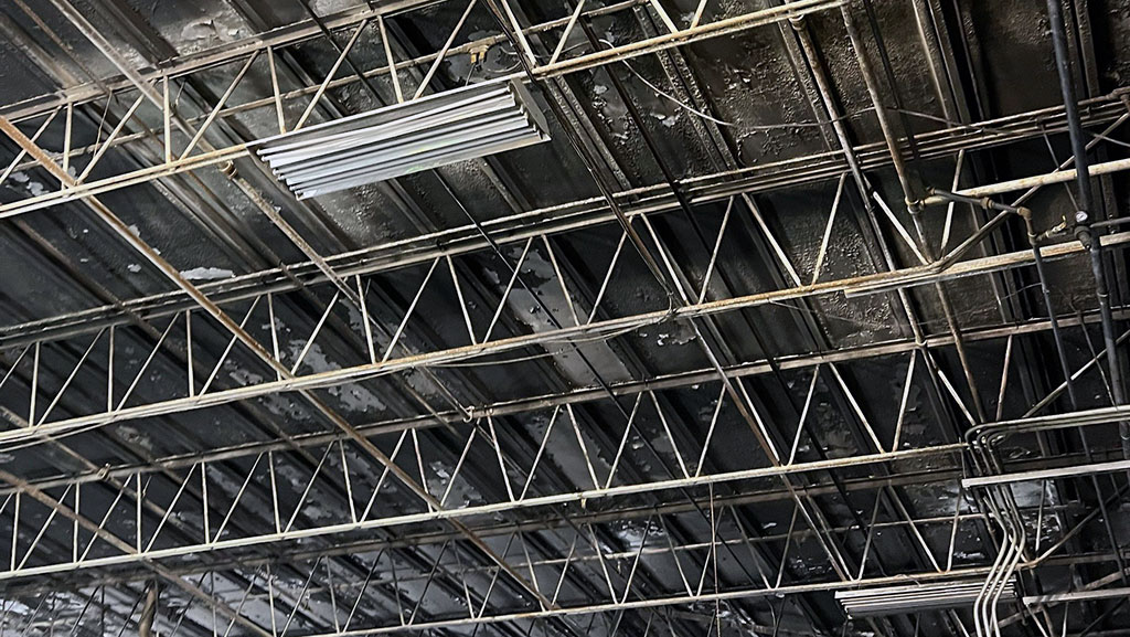 Smoke damage on ceiling in manufacturing facility