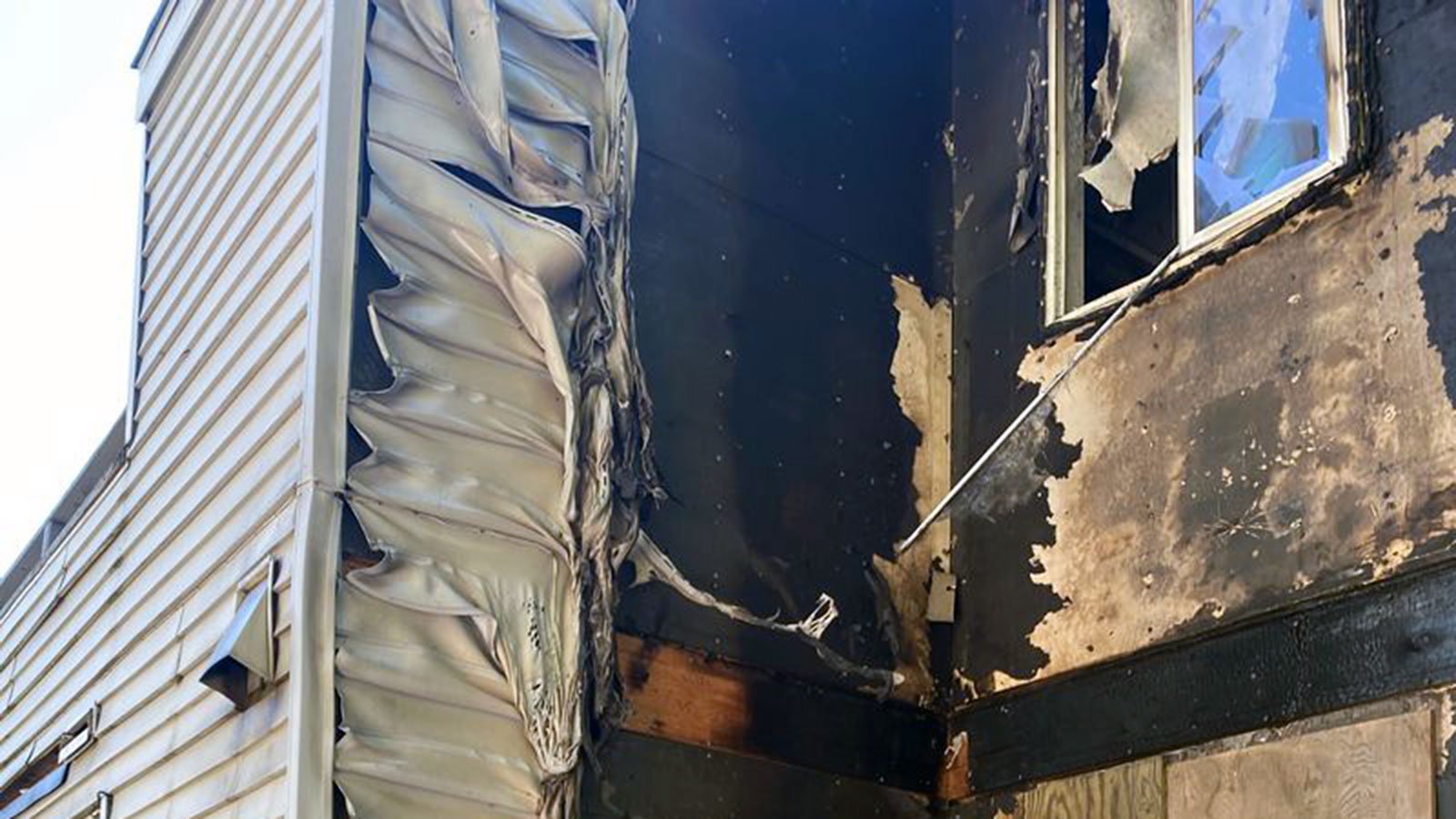 Exterior view of apartment building damaged by fire