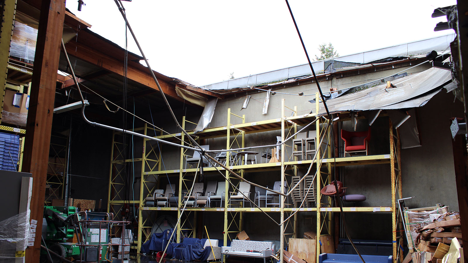 Collapsed roof over warehouse after heavy rains in Seattle