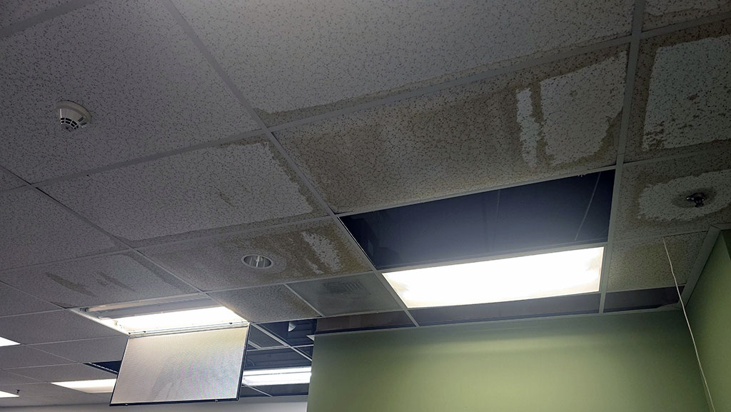 Ceiling damage from burst pipe in commercial building.