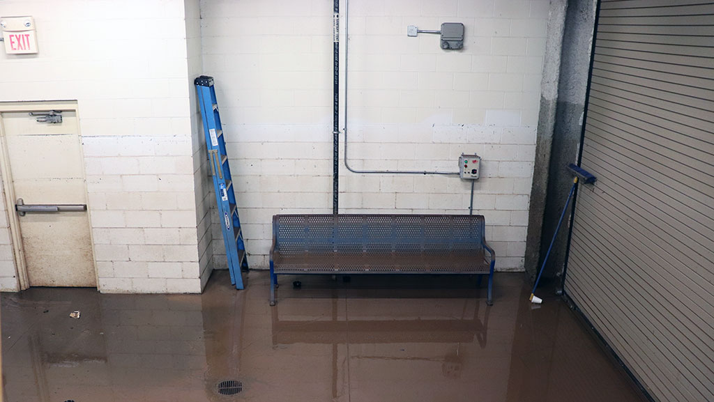 Loading dock area with standing water after river flooded casino building.