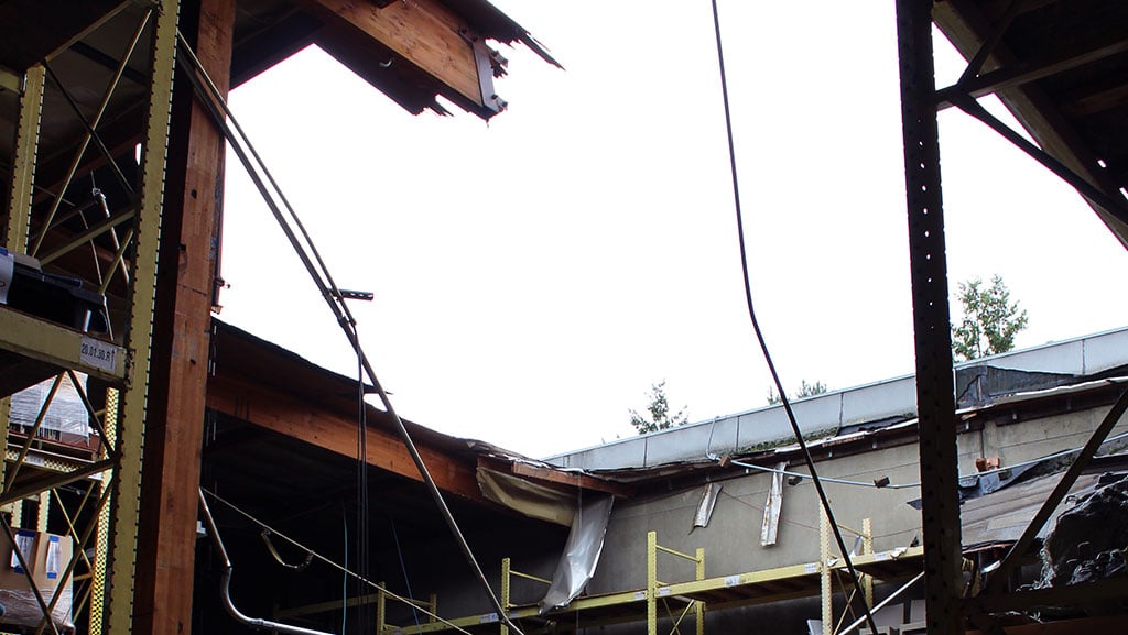 Roof collapse in furniture warehouse facility.