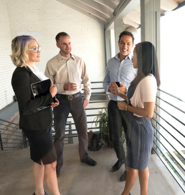Businessmen and women in casual conversation.